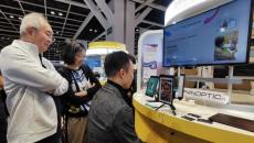A person using PanopticAI's mobile application in a showcase in Hong Kong
