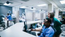 Medical professionals using computer in hospital