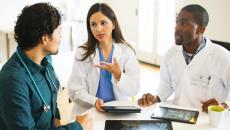 Healthcare professionals reviewing and discussing clinical data