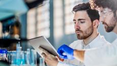Two scientists standing in a laboratory