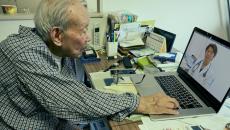 Person interacting with a healthcare professional via a telehealth visit