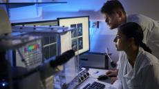 Healthcare professionals reviewing imaging on a PC