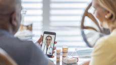 People interacting with a healthcare professional via a smart phone