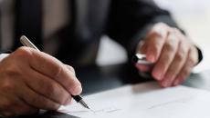 Person signing a document