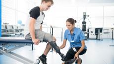 Amputee with a physical therapist
