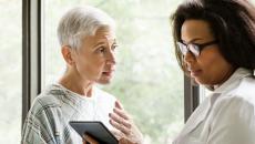 A doctor discussing findings with an older patient