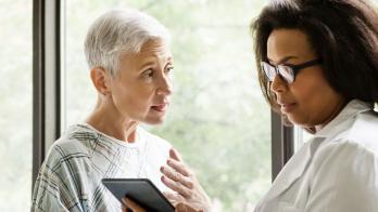 A doctor discussing findings with an older patient