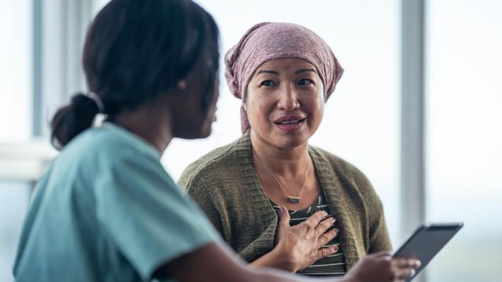 A cancer patient consulting with a doctor